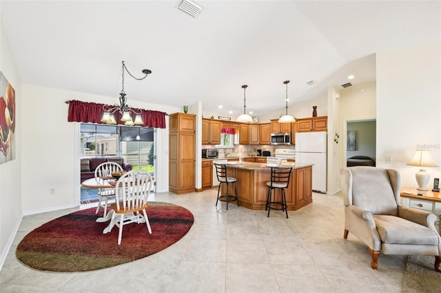 3460 Idlewood Loop, The Villages, FL 32162 - dining room with lofted ceiling and recessed lighting