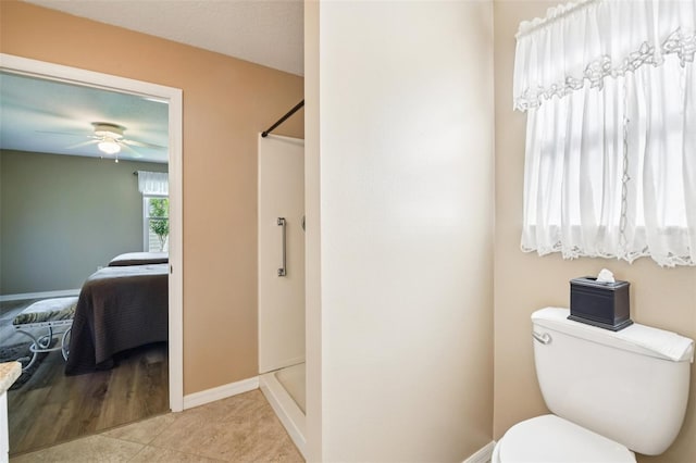 3460 Idlewood Loop, The Villages, FL 32162 - ensuite bathroom featuring a shower stall, ceiling fan, and tile patterned flooring