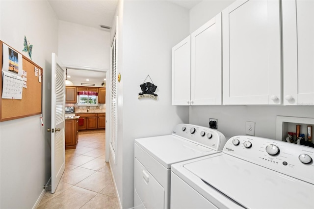 3460 Idlewood Loop, The Villages, FL 32162 - laundry area featuring cabinet space, light tile patterned flooring, and independent washer and dryer