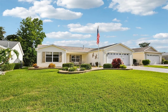 3460 Idlewood Loop, The Villages, FL 32162 - ranch-style home featuring driveway, an attached garage, and a front lawn
