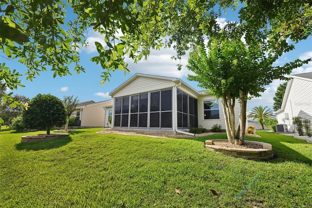 3460 Idlewood Loop, The Villages, FL 32162 - back of property with a sunroom and a yard