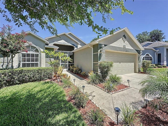 3716 Eversholt St, Clermont, FL 34711 - ranch-style home featuring stucco siding, a garage, and driveway