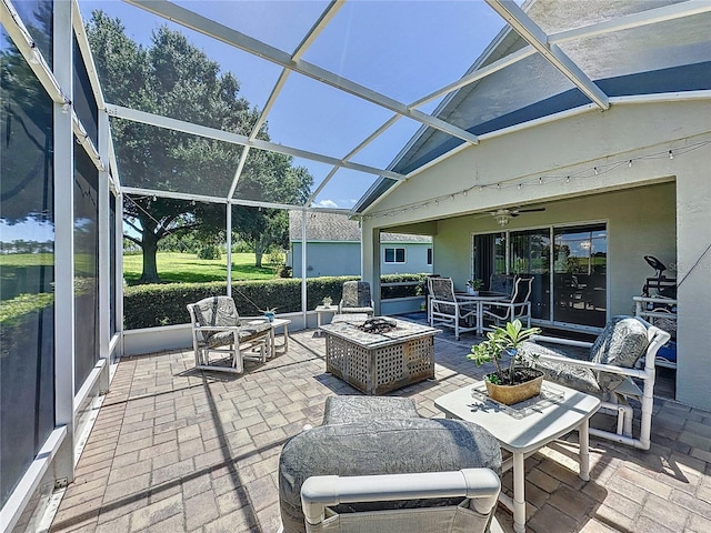 3716 Eversholt St, Clermont, FL 34711 - view of patio / terrace with an outdoor living space with a fire pit, a ceiling fan, and glass enclosure
