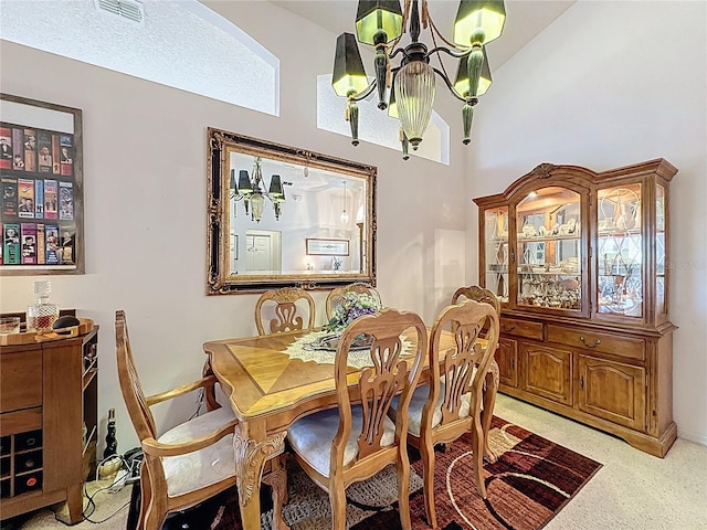 3716 Eversholt St, Clermont, FL 34711 - carpeted dining area featuring a chandelier and a towering ceiling