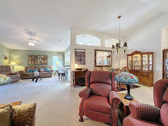 3716 Eversholt St, Clermont, FL 34711 - living area featuring carpet floors, ceiling fan, a chandelier, and lofted ceiling