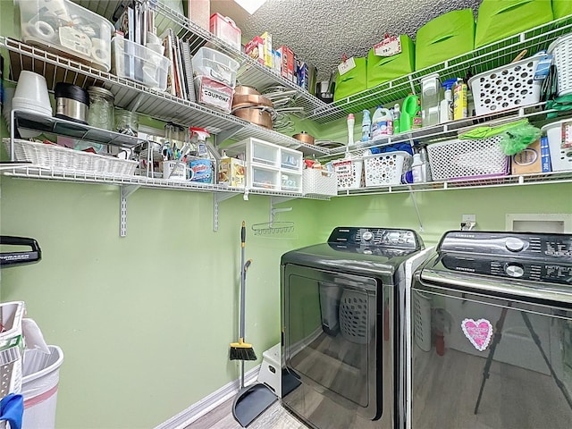 3716 Eversholt St, Clermont, FL 34711 - laundry area featuring separate washer and dryer and wood finished floors