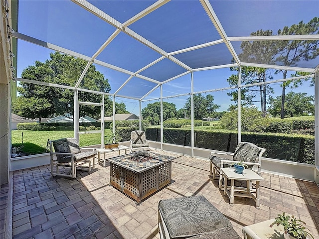 3716 Eversholt St, Clermont, FL 34711 - view of patio / terrace with a lanai and an outdoor living space with a fire pit