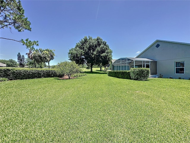 3716 Eversholt St, Clermont, FL 34711 - view of grassy yard with a lanai