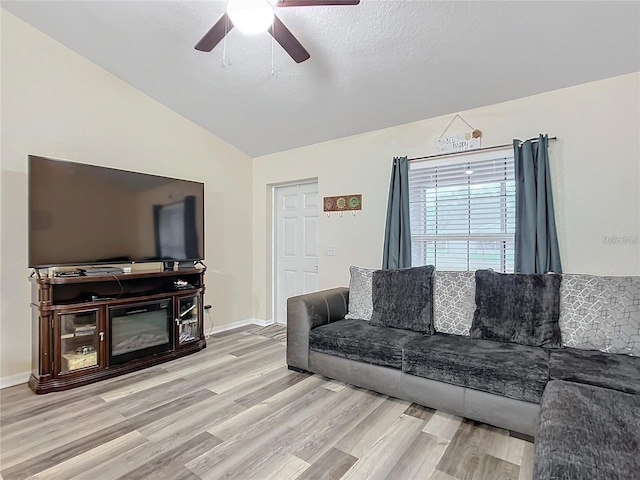 12181 SE 87th Ct, Belleview, FL 34420 - living area featuring wood finished floors, lofted ceiling, and a ceiling fan