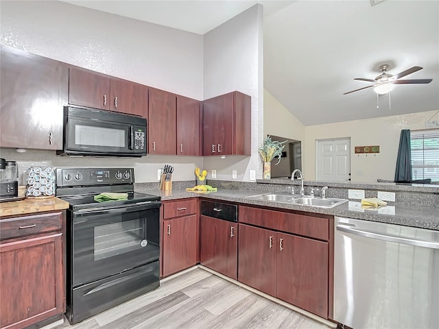 12181 SE 87th Ct, Belleview, FL 34420 - kitchen featuring black appliances, lofted ceiling, light wood finished floors, and a ceiling fan