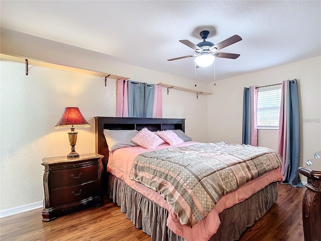 12181 SE 87th Ct, Belleview, FL 34420 - bedroom with wood finished floors and a ceiling fan