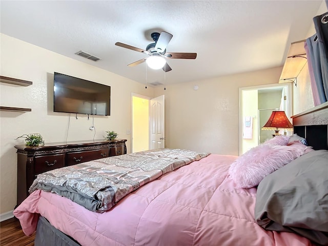 12181 SE 87th Ct, Belleview, FL 34420 - bedroom featuring wood finished floors and a ceiling fan