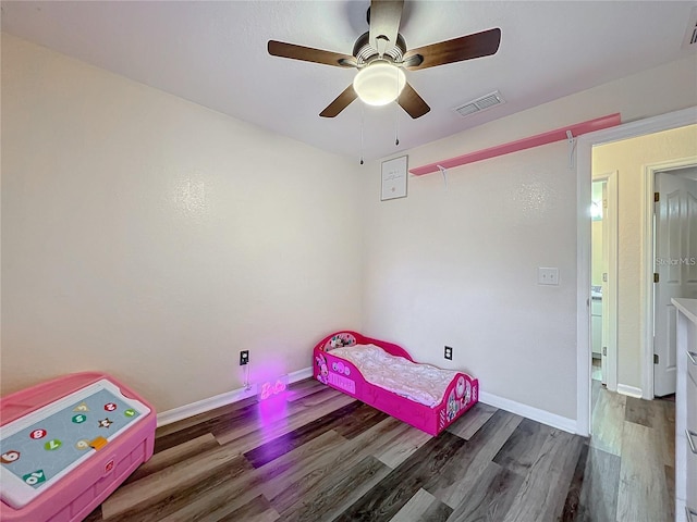 12181 SE 87th Ct, Belleview, FL 34420 - unfurnished bedroom featuring wood finished floors and ceiling fan