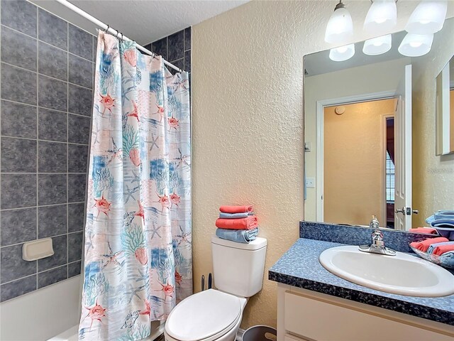 12181 SE 87th Ct, Belleview, FL 34420 - full bath featuring a textured wall, vanity, and shower / tub combo