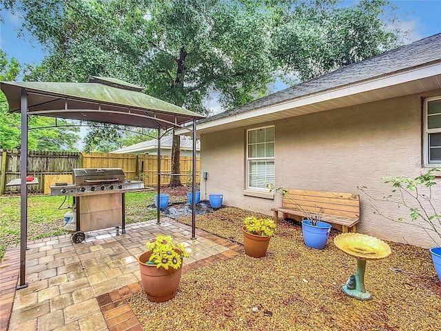 12181 SE 87th Ct, Belleview, FL 34420 - view of patio featuring a gazebo and grilling area