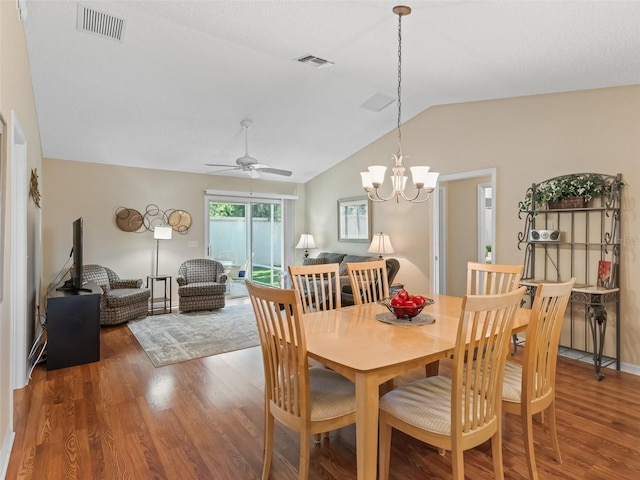 2369 Five Forks Trl, The Villages, FL 32162 - dining area with wood finished floors, lofted ceiling, ceiling fan, and a chandelier