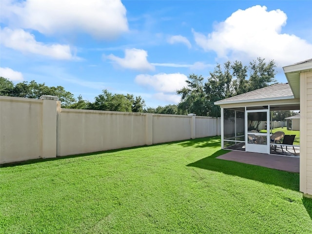 2369 Five Forks Trl, The Villages, FL 32162 - fenced backyard featuring a sunroom and a patio area
