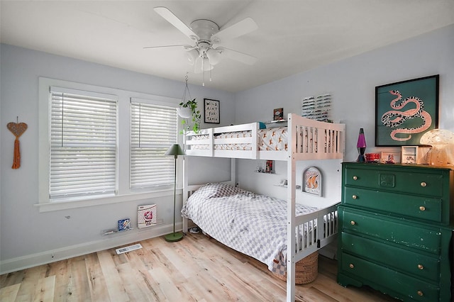 126 E Beach St, Groveland, FL 34736 - bedroom with wood finished floors and a ceiling fan