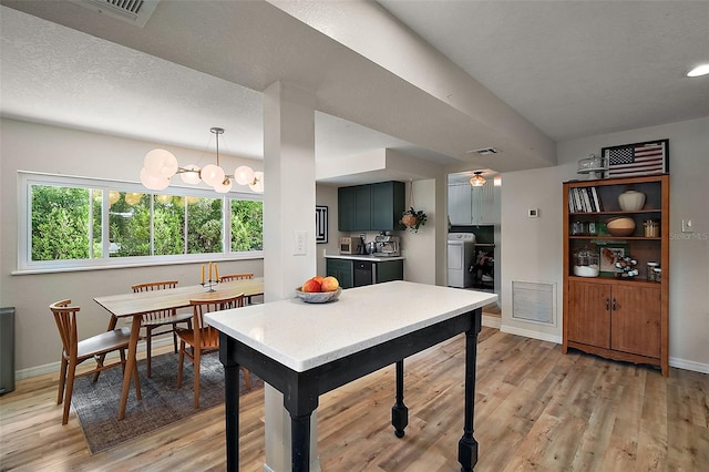 126 E Beach St, Groveland, FL 34736 - dining space featuring washer / clothes dryer and light wood finished floors