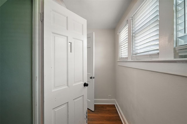 126 E Beach St, Groveland, FL 34736 - doorway to outside with baseboards and dark wood-style flooring