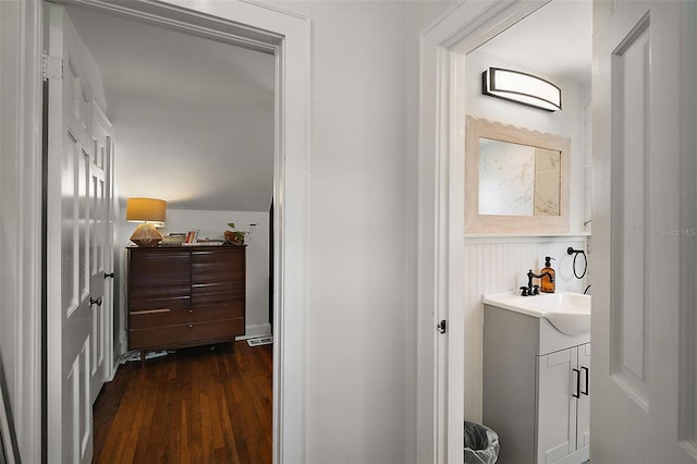 126 E Beach St, Groveland, FL 34736 - hall featuring dark wood-style flooring and a wainscoted wall