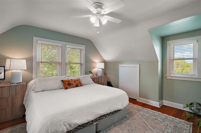 126 E Beach St, Groveland, FL 34736 - bedroom with lofted ceiling, multiple windows, wood finished floors, and ceiling fan