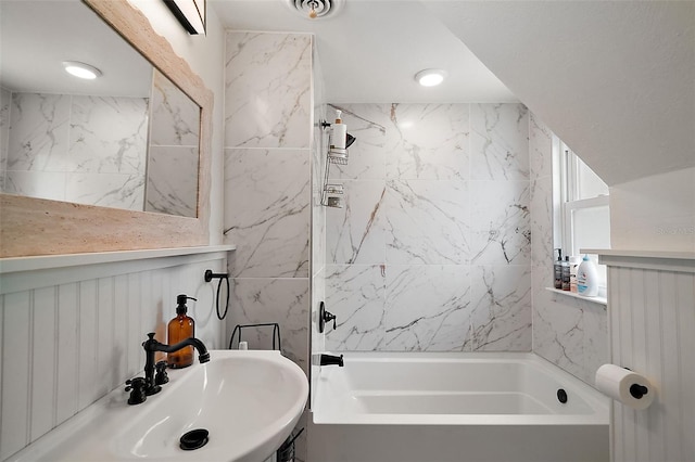 126 E Beach St, Groveland, FL 34736 - bathroom featuring bathtub / shower combination and tile walls