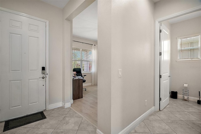 9153 Carmela Ave, Davenport, FL 33897 - foyer entrance with light tile patterned flooring and baseboards