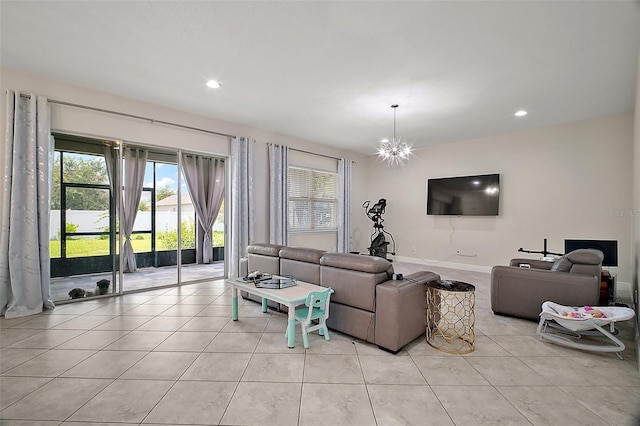 9153 Carmela Ave, Davenport, FL 33897 - living area featuring light tile patterned floors, plenty of natural light, recessed lighting, and a chandelier