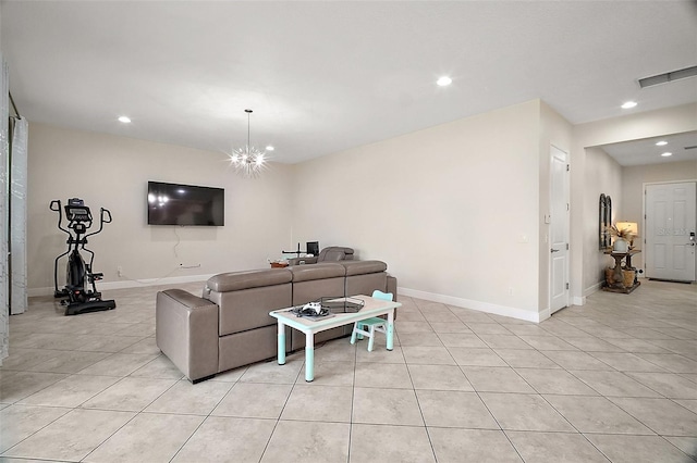 9153 Carmela Ave, Davenport, FL 33897 - living room featuring light tile patterned floors, recessed lighting, and a chandelier