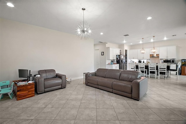 9153 Carmela Ave, Davenport, FL 33897 - living area with a chandelier, light tile patterned floors, and recessed lighting