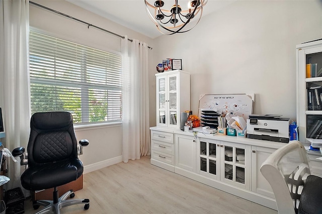 9153 Carmela Ave, Davenport, FL 33897 - office area with a chandelier and light wood-style flooring