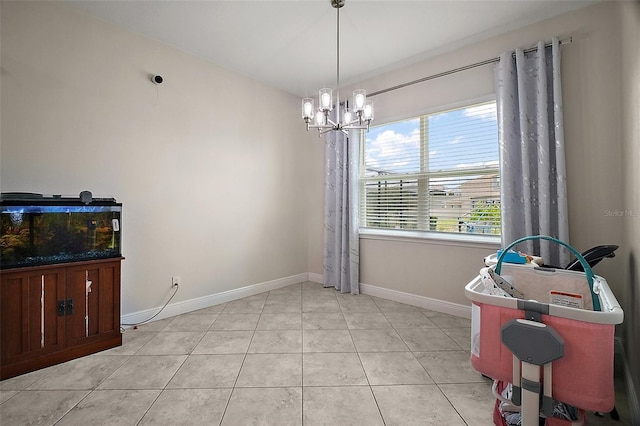 9153 Carmela Ave, Davenport, FL 33897 - dining space featuring a chandelier and light tile patterned floors