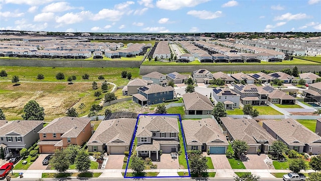 9153 Carmela Ave, Davenport, FL 33897 - aerial perspective of suburban area with property boundaries highlighted