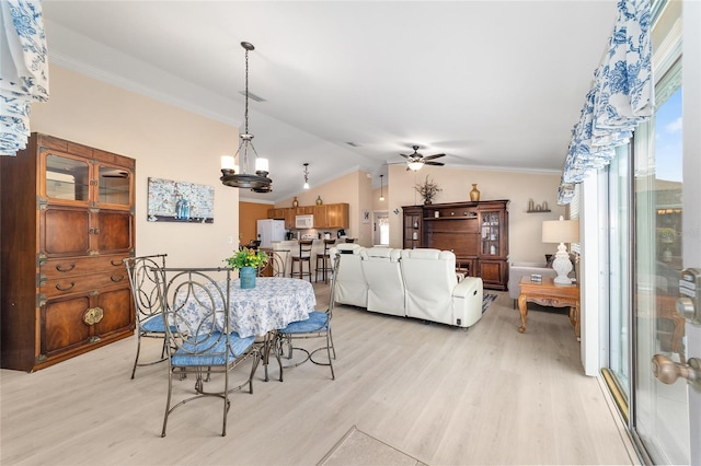 2237 Jetta Way, The Villages, FL 32162 - dining space featuring light wood-type flooring, a ceiling fan, vaulted ceiling, and ornamental molding