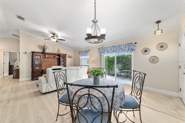 2237 Jetta Way, The Villages, FL 32162 - dining area with lofted ceiling, ceiling fan, ornamental molding, a chandelier, and light wood finished floors