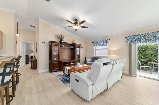 2237 Jetta Way, The Villages, FL 32162 - living room with lofted ceiling, light wood finished floors, a ceiling fan, and ornamental molding