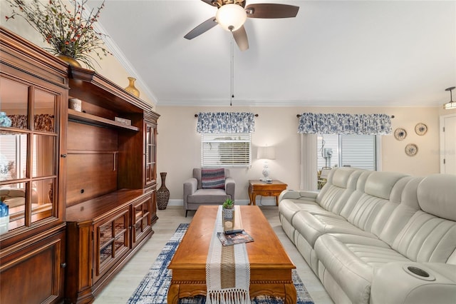 2237 Jetta Way, The Villages, FL 32162 - living room with ceiling fan, ornamental molding, and light wood-type flooring