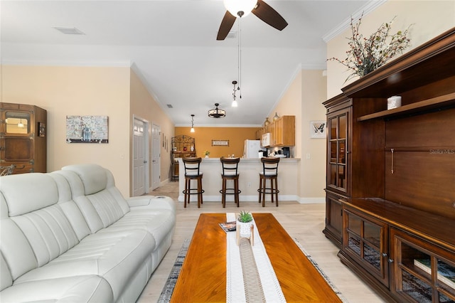 2237 Jetta Way, The Villages, FL 32162 - living room featuring ceiling fan and ornamental molding