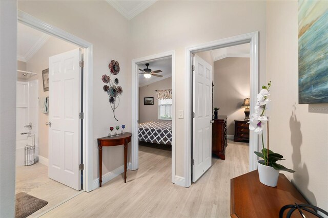 2237 Jetta Way, The Villages, FL 32162 - hall with crown molding, light wood finished floors, and vaulted ceiling