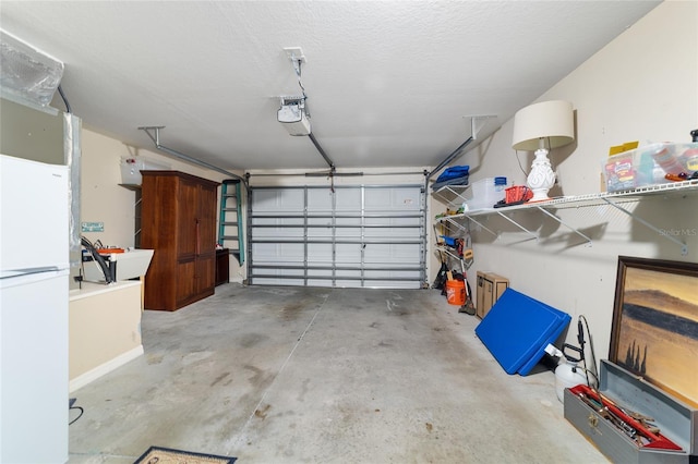 2237 Jetta Way, The Villages, FL 32162 - garage with freestanding refrigerator and a garage door opener