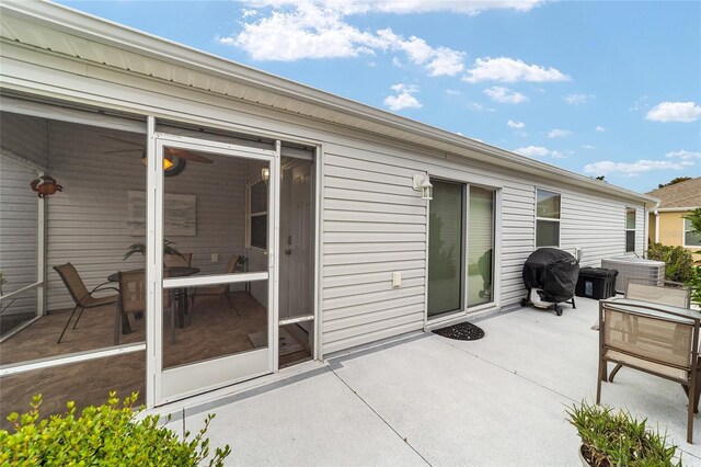 2237 Jetta Way, The Villages, FL 32162 - view of patio with area for grilling and a sunroom
