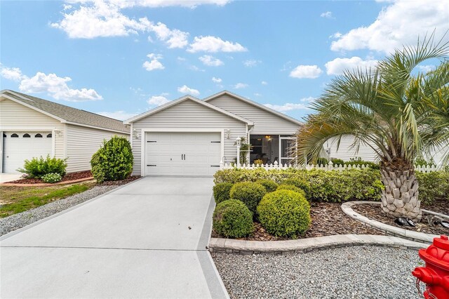2237 Jetta Way, The Villages, FL 32162 - ranch-style house with driveway and a garage