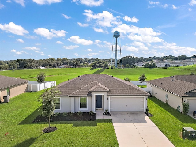 1940 Piedmont Ct, Mascotte, FL 34753 - ranch-style house featuring concrete driveway, an attached garage, and stucco siding