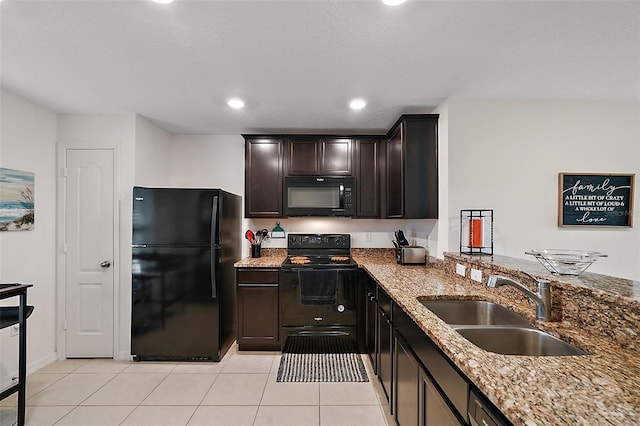 1940 Piedmont Ct, Mascotte, FL 34753 - kitchen featuring black appliances, light stone countertops, light tile patterned flooring, dark brown cabinetry, and recessed lighting