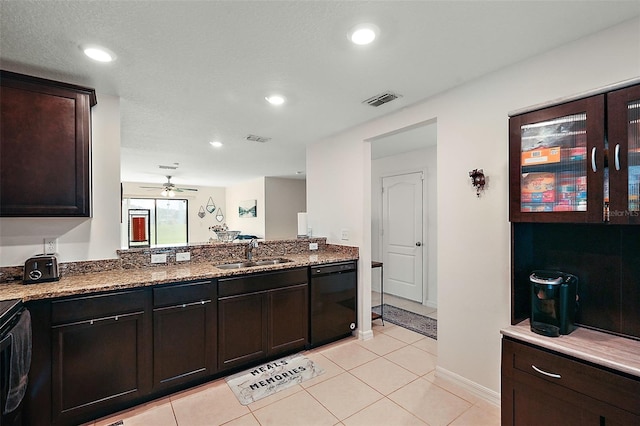 1940 Piedmont Ct, Mascotte, FL 34753 - kitchen with dishwasher, a ceiling fan, light tile patterned flooring, stone counters, and dark brown cabinetry