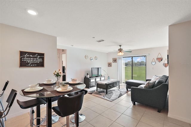 1940 Piedmont Ct, Mascotte, FL 34753 - dining room featuring ceiling fan and light tile patterned floors