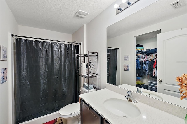 1940 Piedmont Ct, Mascotte, FL 34753 - bathroom with vanity, curtained shower, a textured ceiling, and a spacious closet