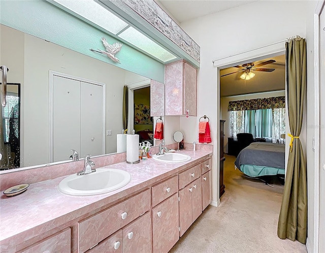 27141 Racquet Cir, Leesburg, FL 34748 - bathroom featuring connected bathroom, double vanity, and ceiling fan