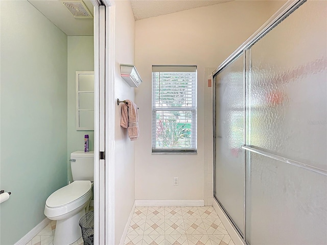 27141 Racquet Cir, Leesburg, FL 34748 - bathroom with a shower with shower door and tile patterned flooring